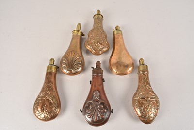 Lot 784 - A group of six vintage brass/copper powder flasks