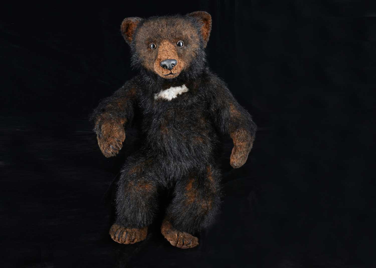 Lot 15 - A limited edition ‘The Wildlife Sculpture’ of a black bear cub by Joan Stevenson (Canada) teddy bear from the Growlies of Scotland collection