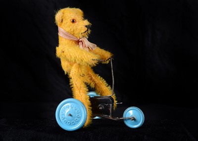 Lot 105 - A 1930s French clockwork teddy bear on tricycle