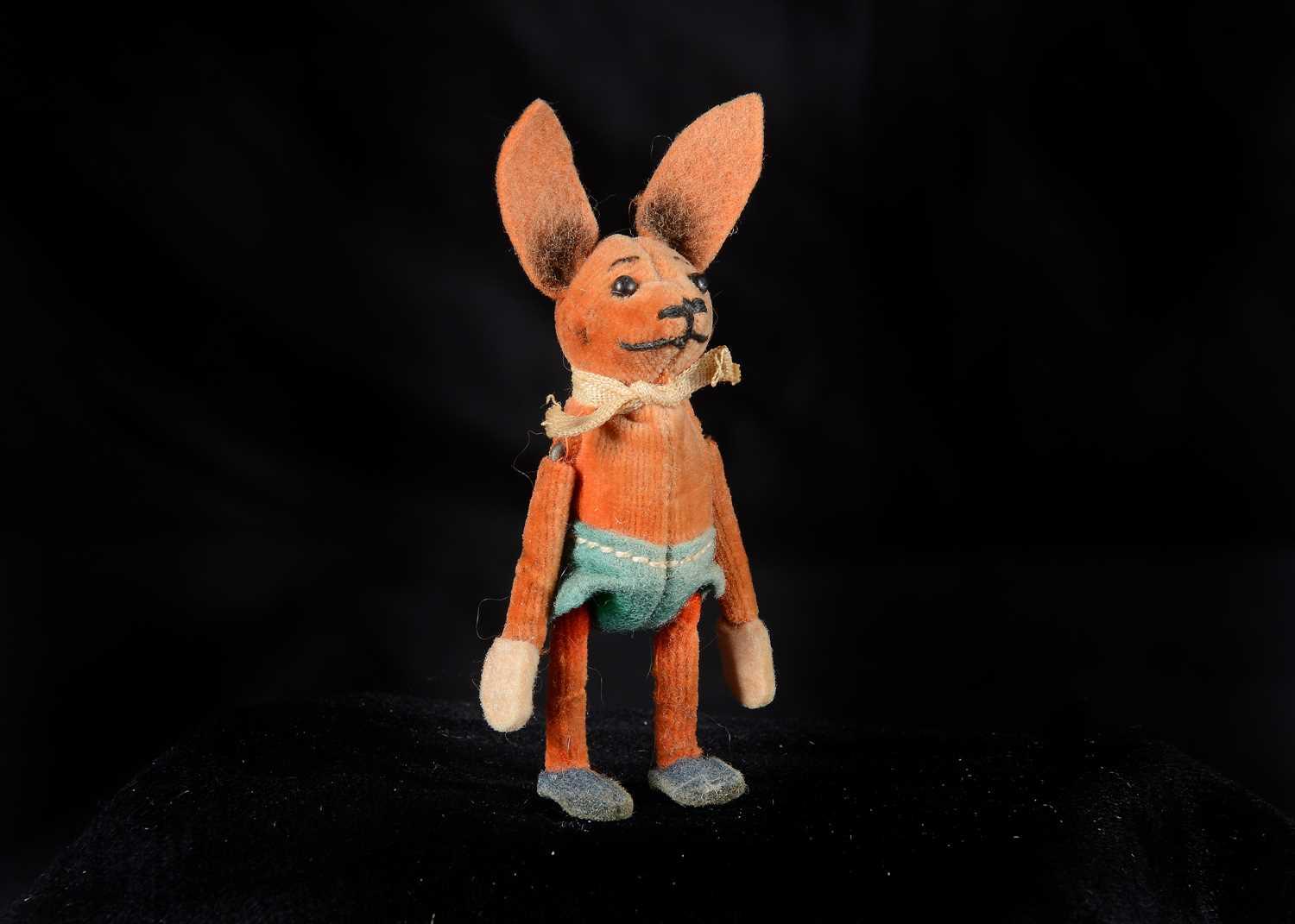 Lot 123 - A miniature Schuco orange velvet rabbit,