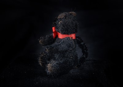 Lot 131 - A rare British ‘soldier’ lucky black cat