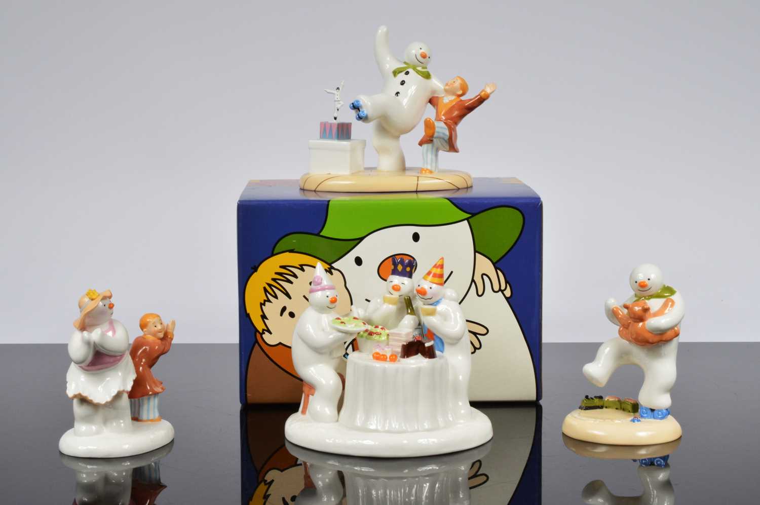 Lot 89 - A collection of four Coalport Snowman figurines