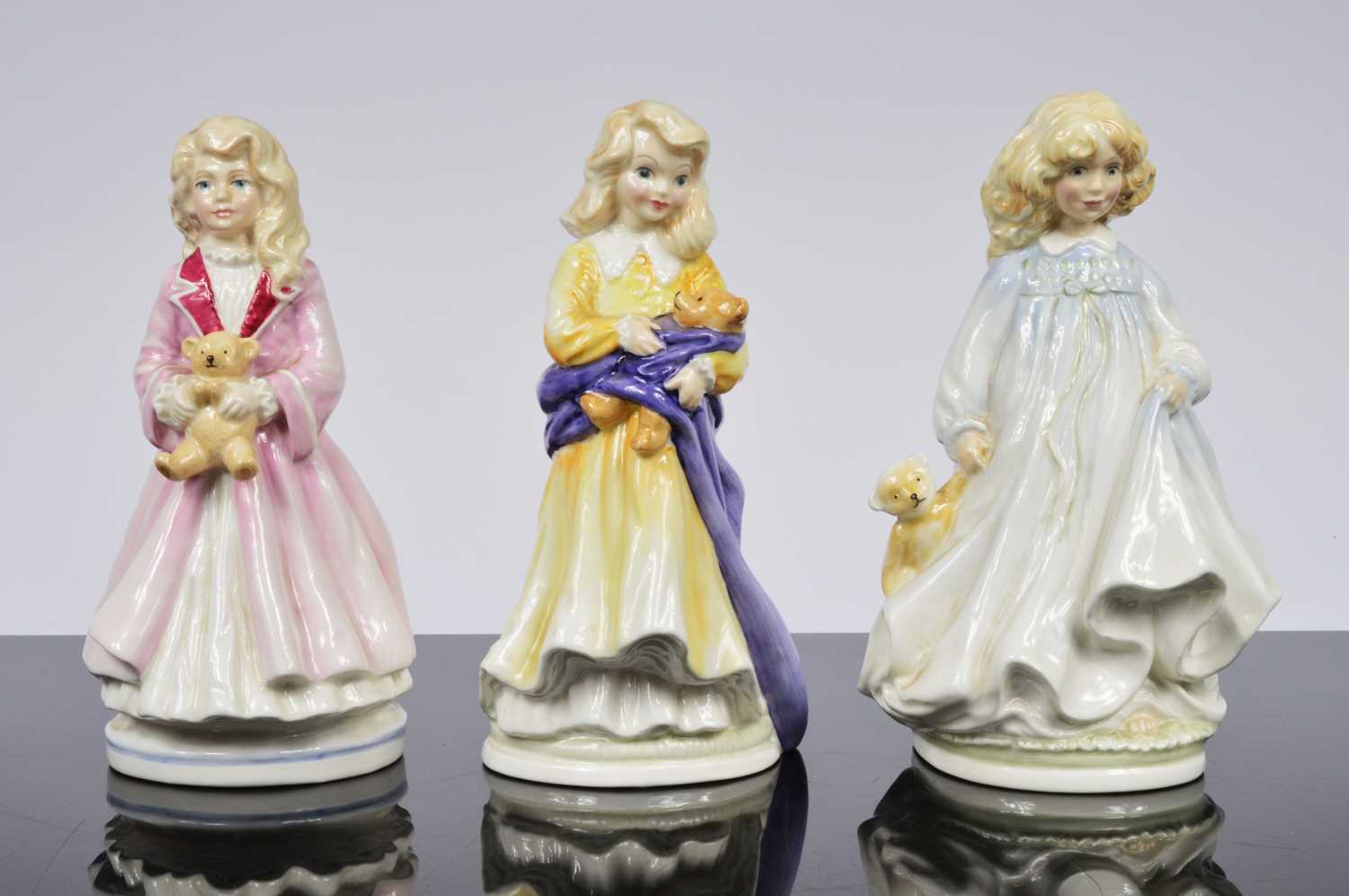 Lot 92 - A collection of three Royal Doulton NSPCC figurines