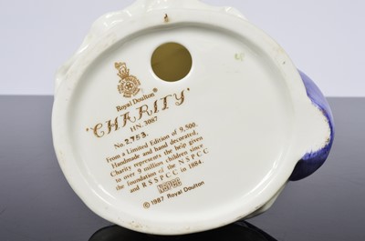 Lot 92 - A collection of three Royal Doulton NSPCC figurines