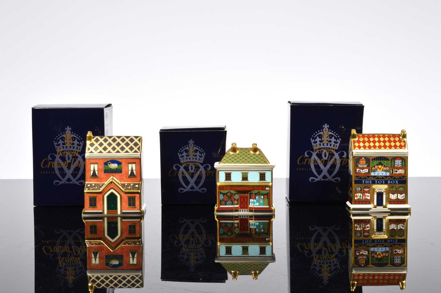 Lot 95 - A set of three Royal Crown Derby mini houses