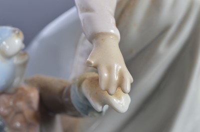 Lot 97 - A Lladro porcelain Alice in Wonderland figural group