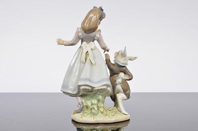Lot 97 - A Lladro porcelain Alice in Wonderland figural group