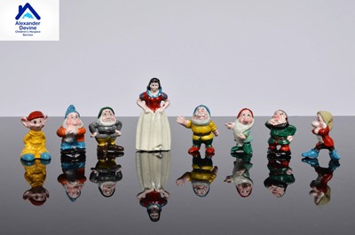 Lot 101 - A set of Snow white and the Seven Dwarfs ceramic miniature figures