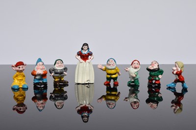 Lot 101 - A set of Snow white and the Seven Dwarfs ceramic miniature figures
