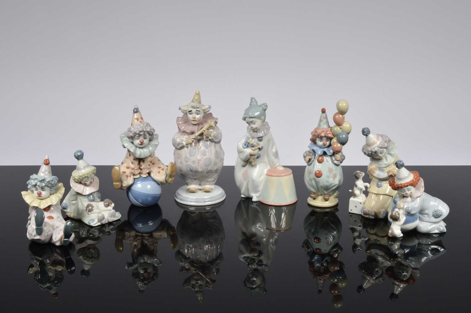 Lot 106 - A collection of eight Lladro clowns figures