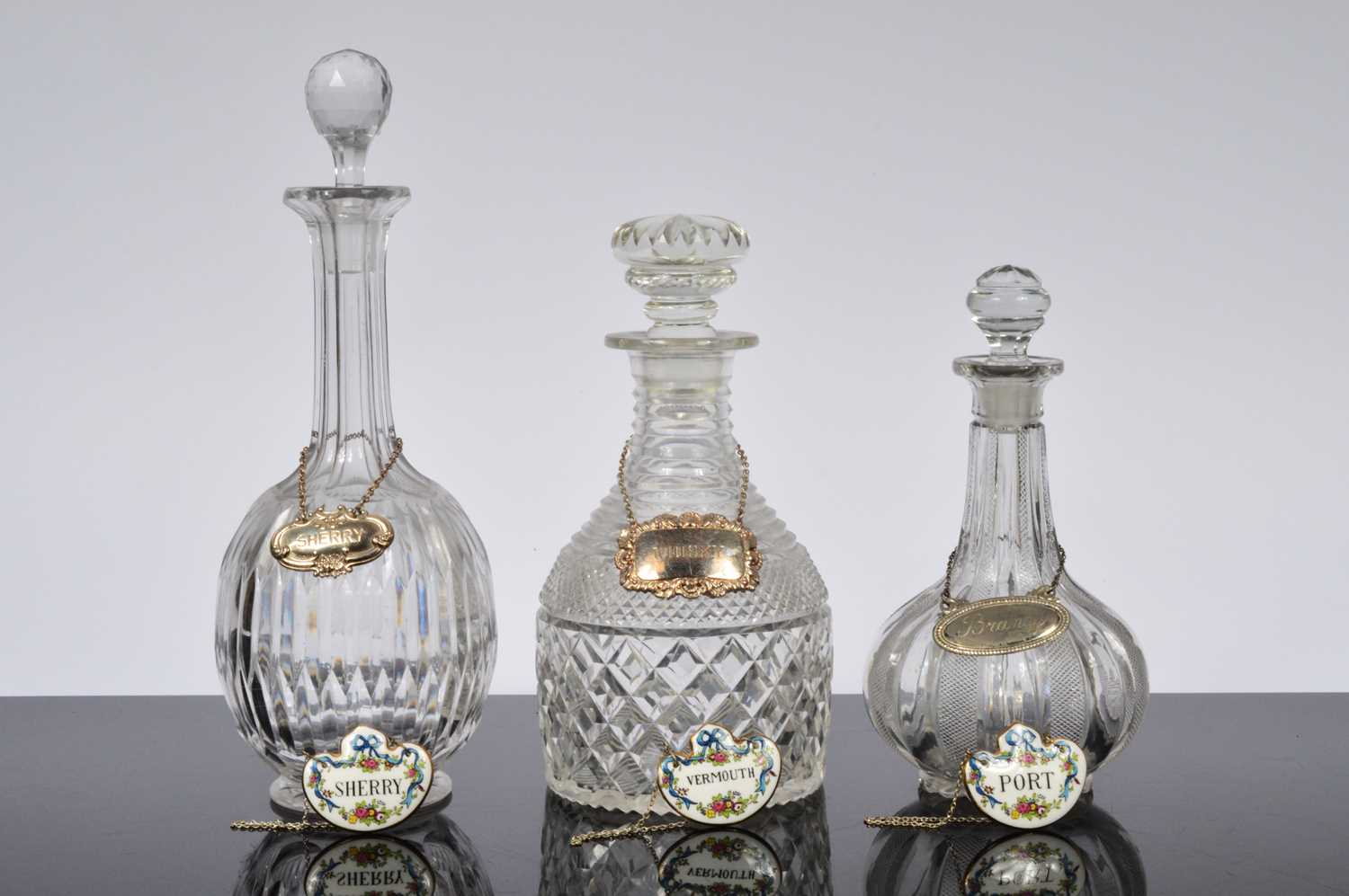 Lot 114 - Three cut glass decanters