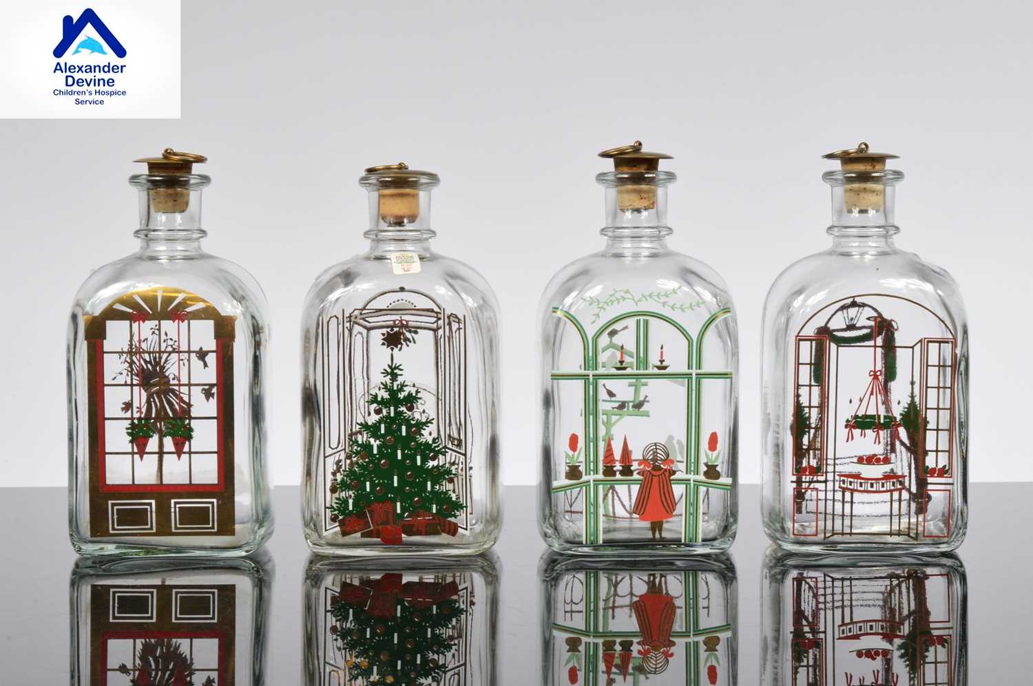 Lot 123 - A set of four Holmegaard Christmas decanters