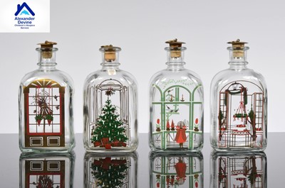 Lot 123 - A set of four Holmegaard Christmas decanters