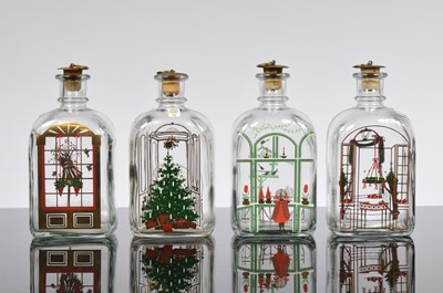 Lot 123 - A set of four Holmegaard Christmas decanters
