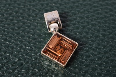 Lot 160 - A Sterling Silver and Amethyst cross pendant