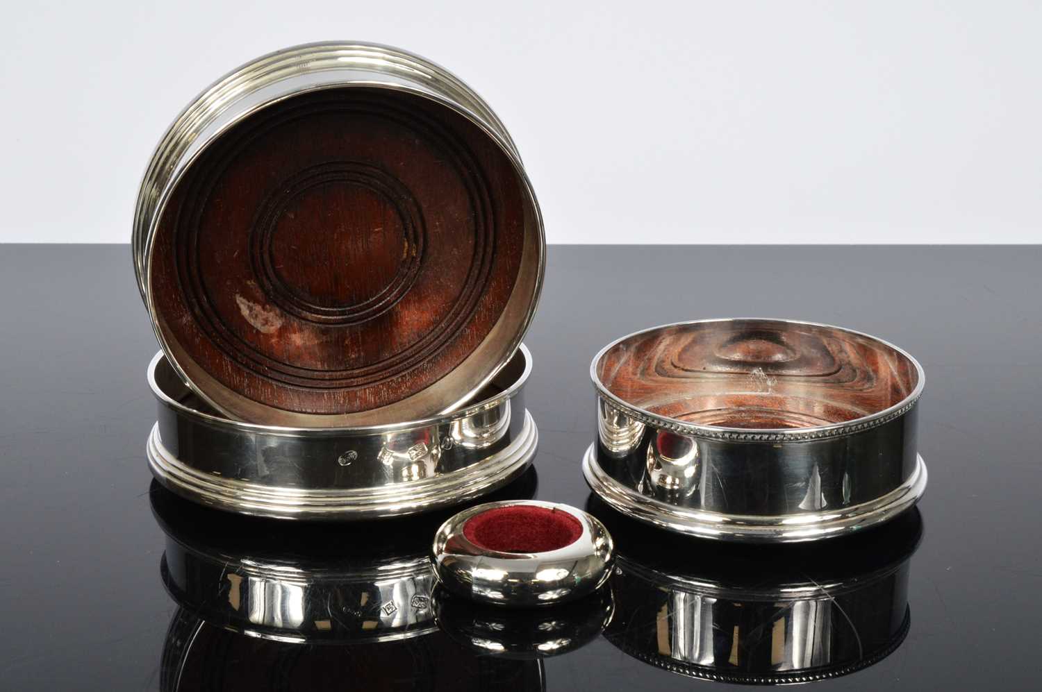 Lot 165 - A pair of Wine bottle coasters