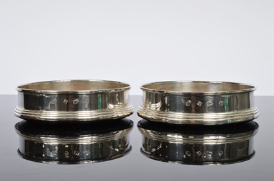 Lot 165 - A pair of Wine bottle coasters