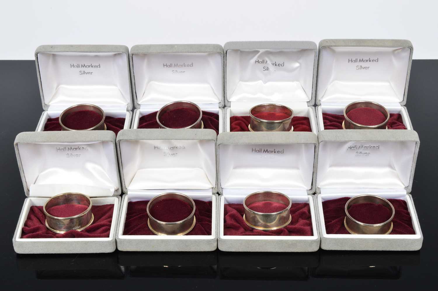 Lot 166 - A set of eight Silver napkin rings