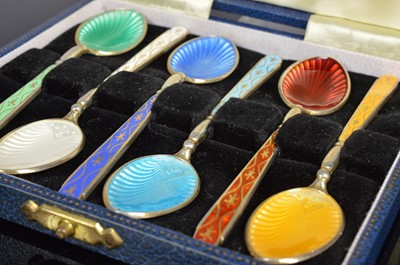Lot 171 - A set of six enamel and silver Coffee spoons
