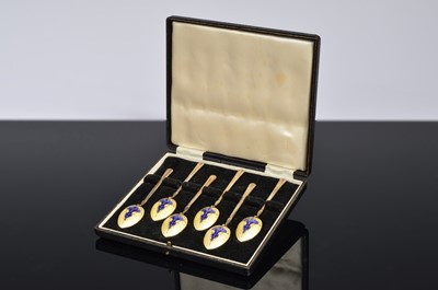 Lot 172 - A set of six enamel and silver Coffee spoons