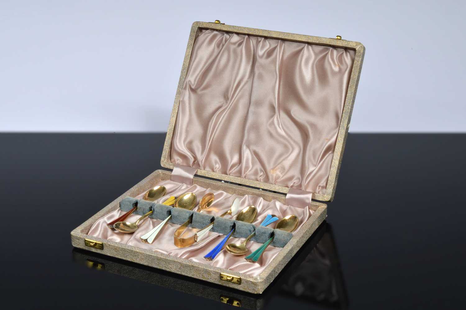 Lot 173 - A set of Norwegian silver enamelled coffee spoons