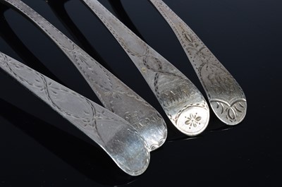 Lot 185 - A set of four Georgian bright cut tablespoons