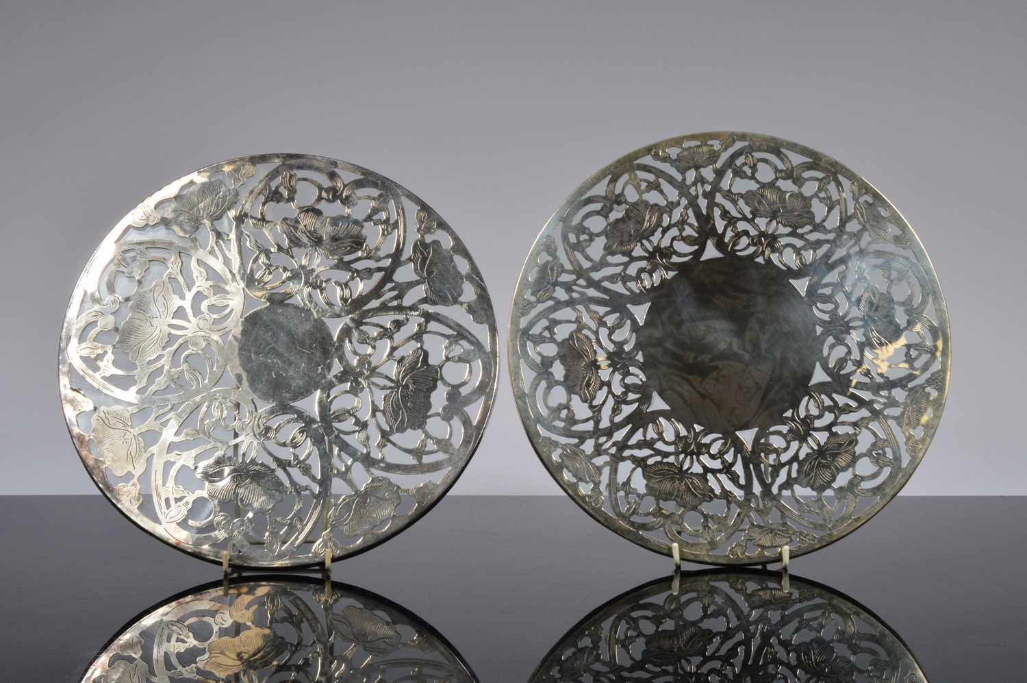 Lot 187 - A set of ten sterling silver and glass trivets