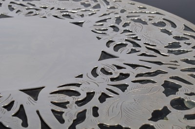 Lot 187 - A set of ten sterling silver and glass trivets