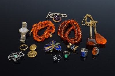 Lot 214 - A string of graduated spherical amber beads