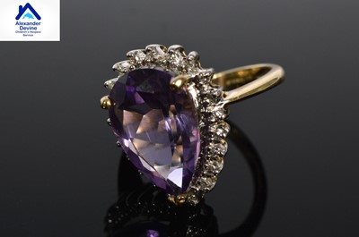 Lot 222 - A 9ct gold ring with pear shaped amethyst stone