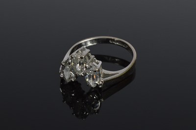 Lot 236 - A three stone 18ct white gold diamond set wishbone dress ring