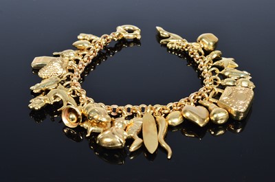Lot 239 - A 9ct gold charm bracelet