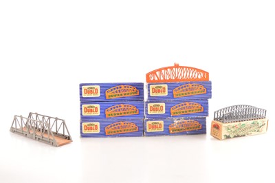 Lot 67 - Four Hornby-Dublo 00 Gauge 2-3-Rail D1 Girder Bridges and a Master Model and Tri-ang Girder Birdge (6 + two empty boxes)