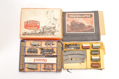 Lot 139 - Uncommon 00 Gauge Formo electric 3-Rail Train Set and Pyramid Toys Trackmaster pre Tri-ang 00 gauge Clockwork Train Set ( 2 sets)