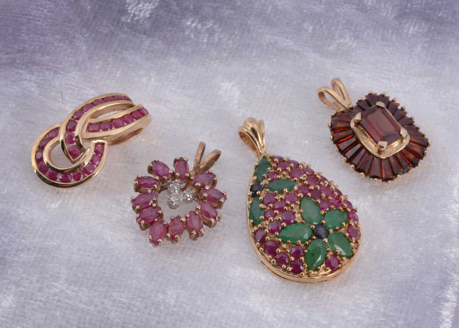 Lot 7 - A 9ct gold ruby and emerald drop pendant