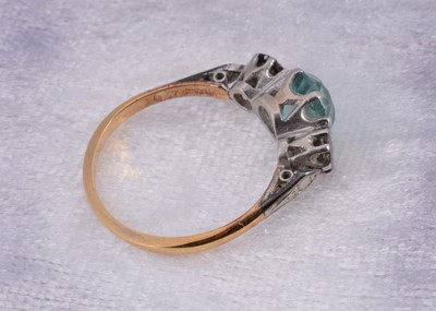 Lot 10 - An 18ct gold and platinum zircon and diamond three stone dress ring