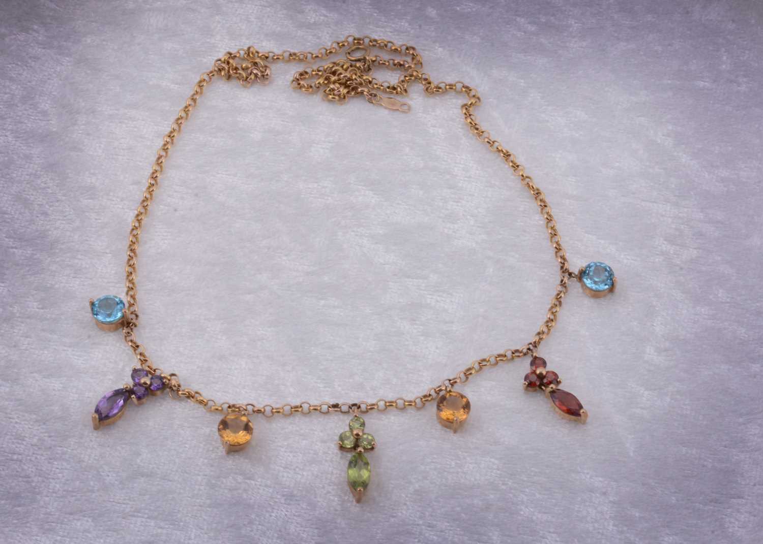 Lot 15 - A yellow metal QVC multi gem set fringe necklace