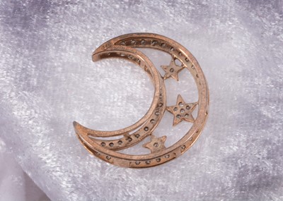Lot 16 - A 9ct gold crescent moon and star gem set pendant