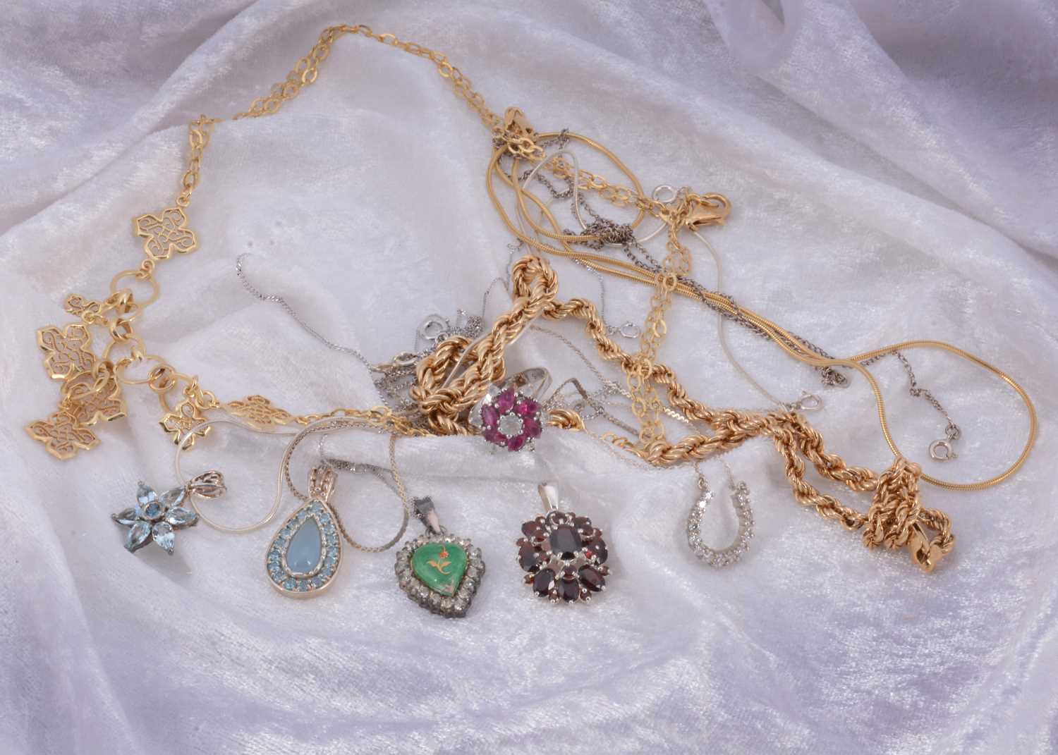 Lot 27 - A collection of silver and silver gilt jewels