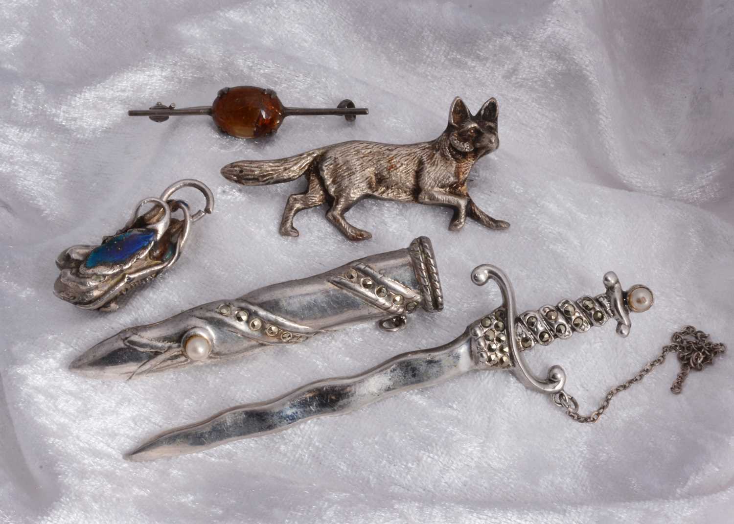 Lot 32 - A silver marcasite and simulated pearl sword brooch