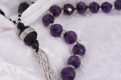 Lot 33 - An art deco flapper's necklace with black and white glass beads