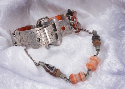 Lot 41 - A silver and carnelian belt and buckle style Scottish bracelet