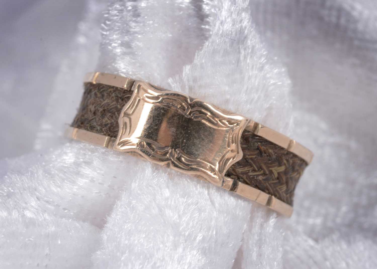 Lot 42 - A 19th Century gold and plaited hair mourning ring