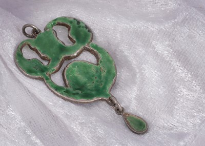 Lot 46 - An arts and crafts silver and enamel clover decorated pendant