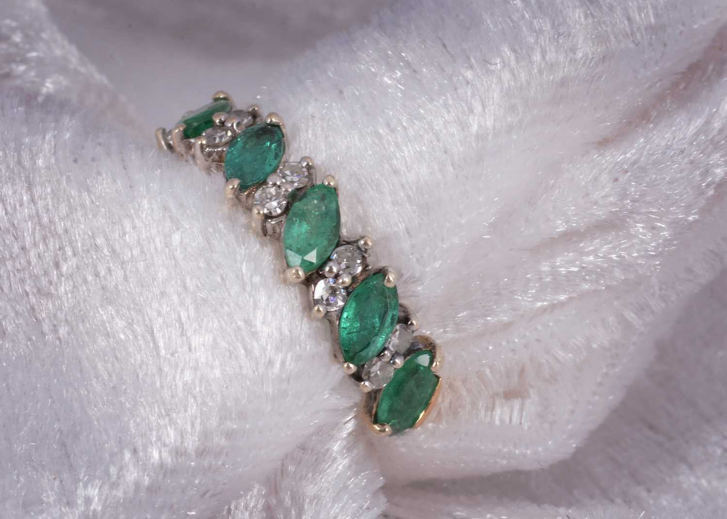 Lot 51 - A 9ct gold emerald and diamond half hoop dress ring