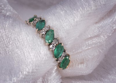 Lot 51 - A 9ct gold emerald and diamond half hoop dress ring