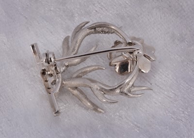 Lot 53 - A Wadham crest diamond enamel set brooch