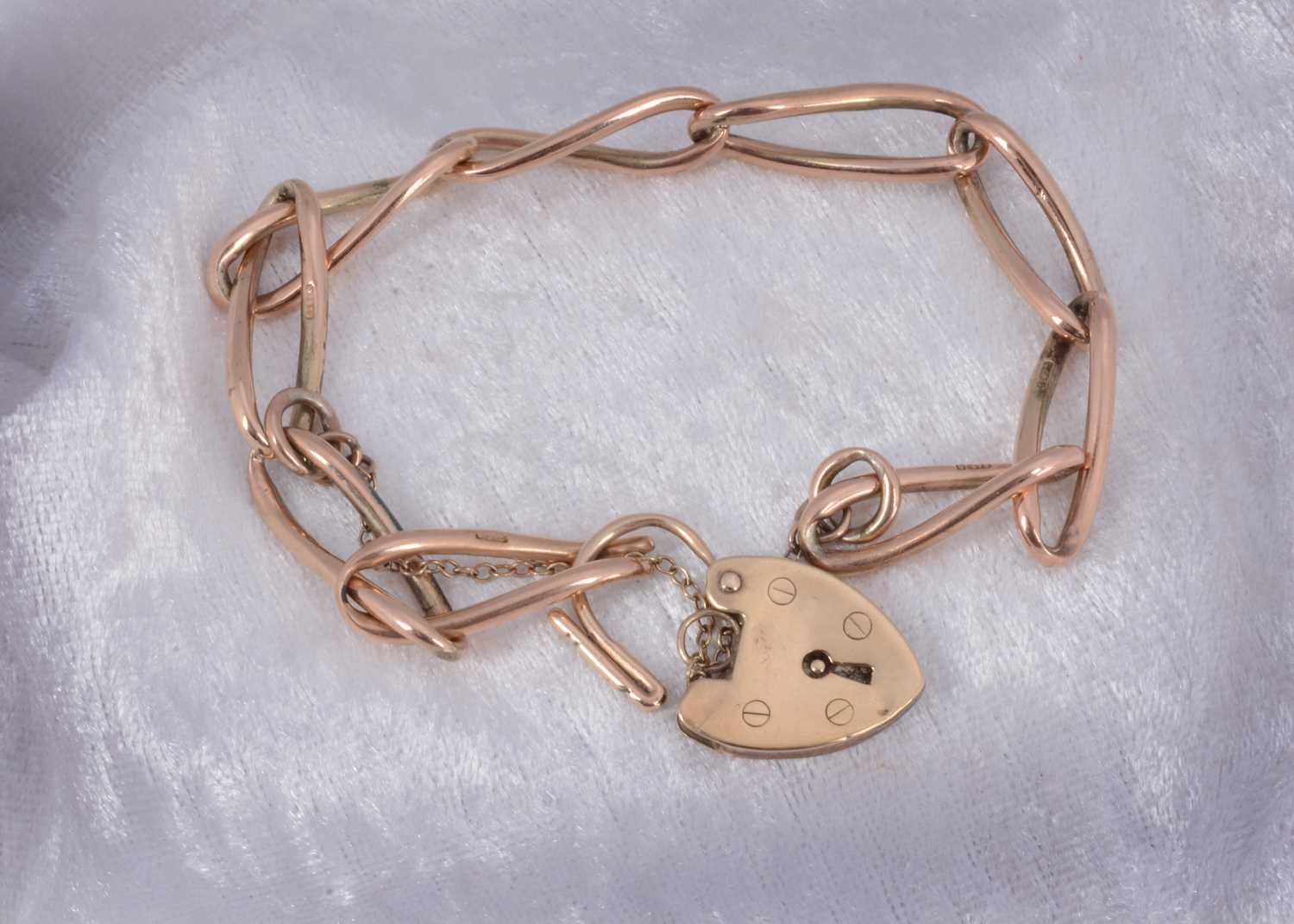 Lot 60 - A 9ct gold curb linked padlock clasp bracelet