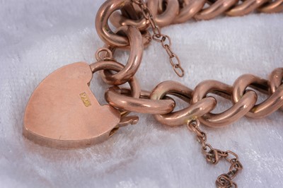 Lot 63 - A 9ct rose gold curb link bracelet.