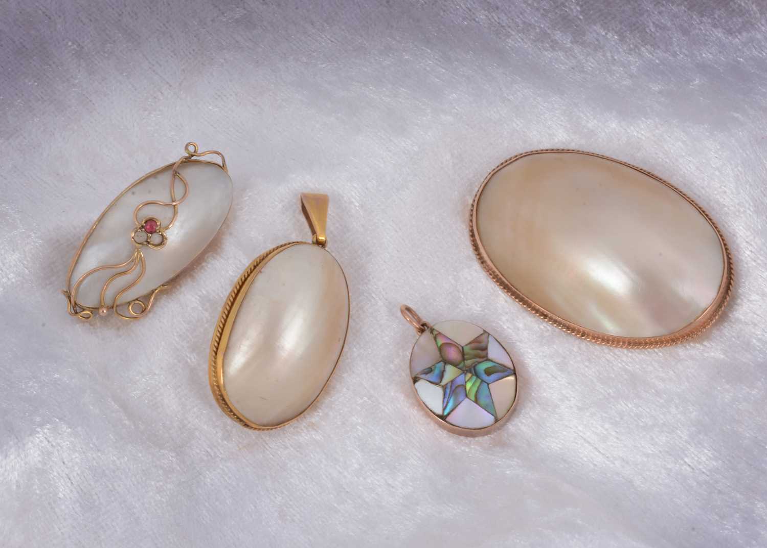 Lot 67 - A collection of mother of pearl gold set jewellery